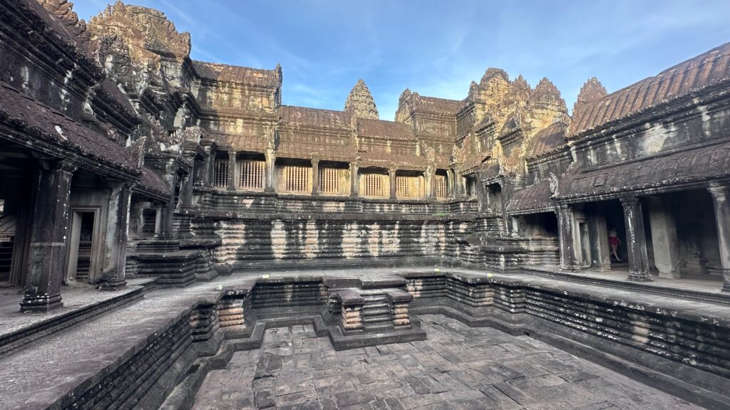 Ancient courtyard and stone galleries inside Angkor Wat, Cambodia