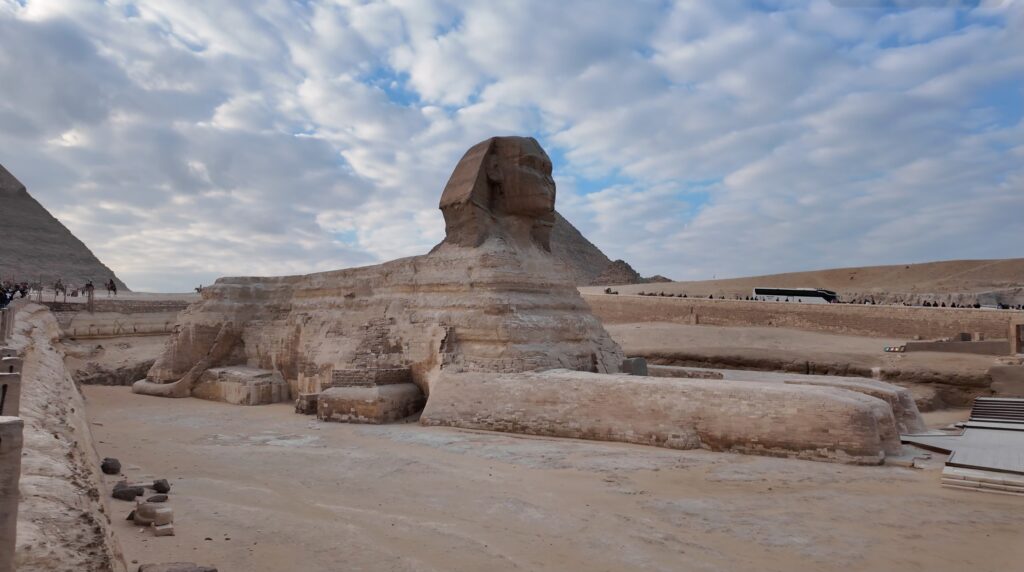 Great Sphinx of Giza with a pyramid in the background