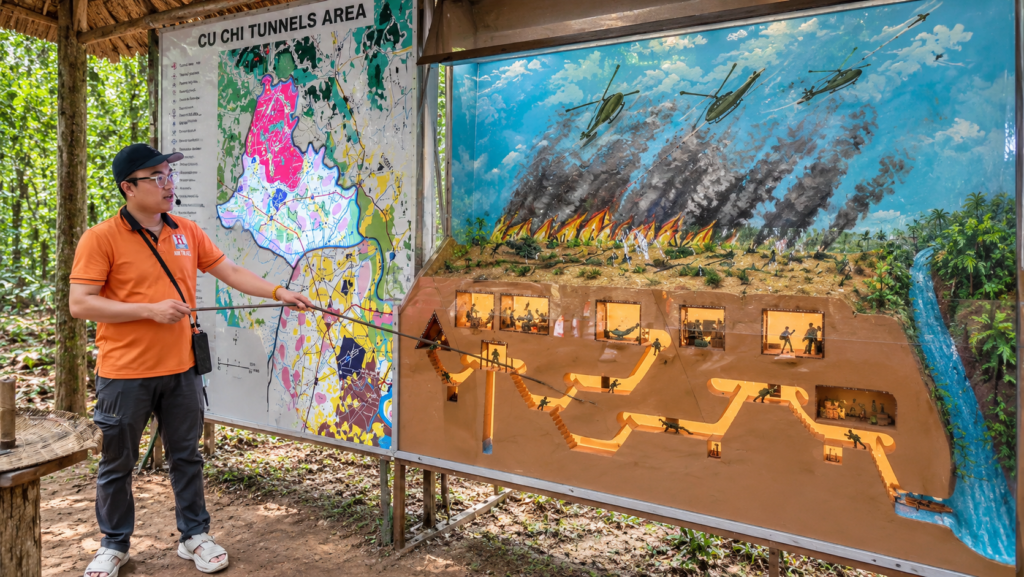 Cu Chi Tunnels underground network model and map explained by a local tour guide in Vietnam.