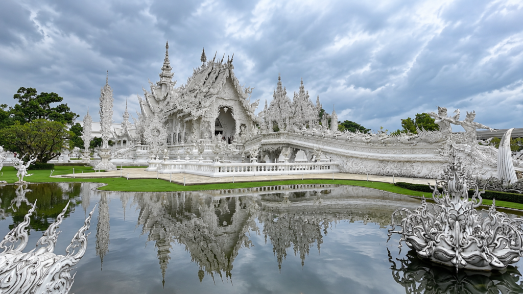 White Temple (Wat Rong Khun) in Chiang Rai, Thailand, reflected in a pond